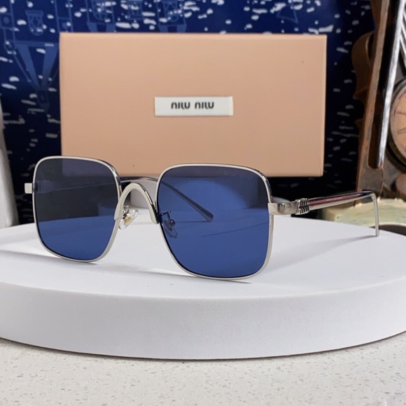 Miu Miu Sunglasses with Silver Frames and Blue Lenses